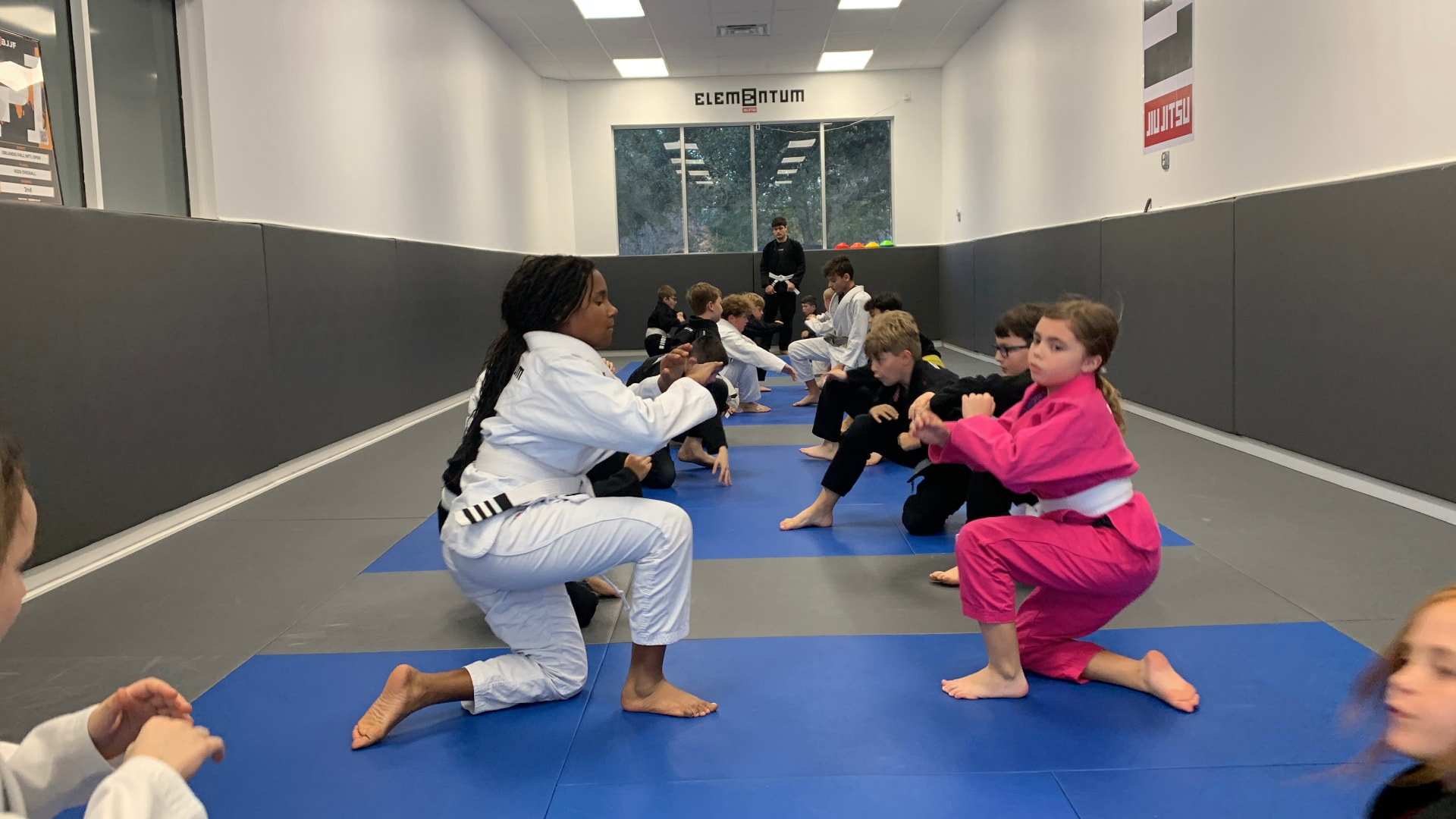 Juniors class (ages 8–12) at Elementum Jiu Jitsu Oviedo