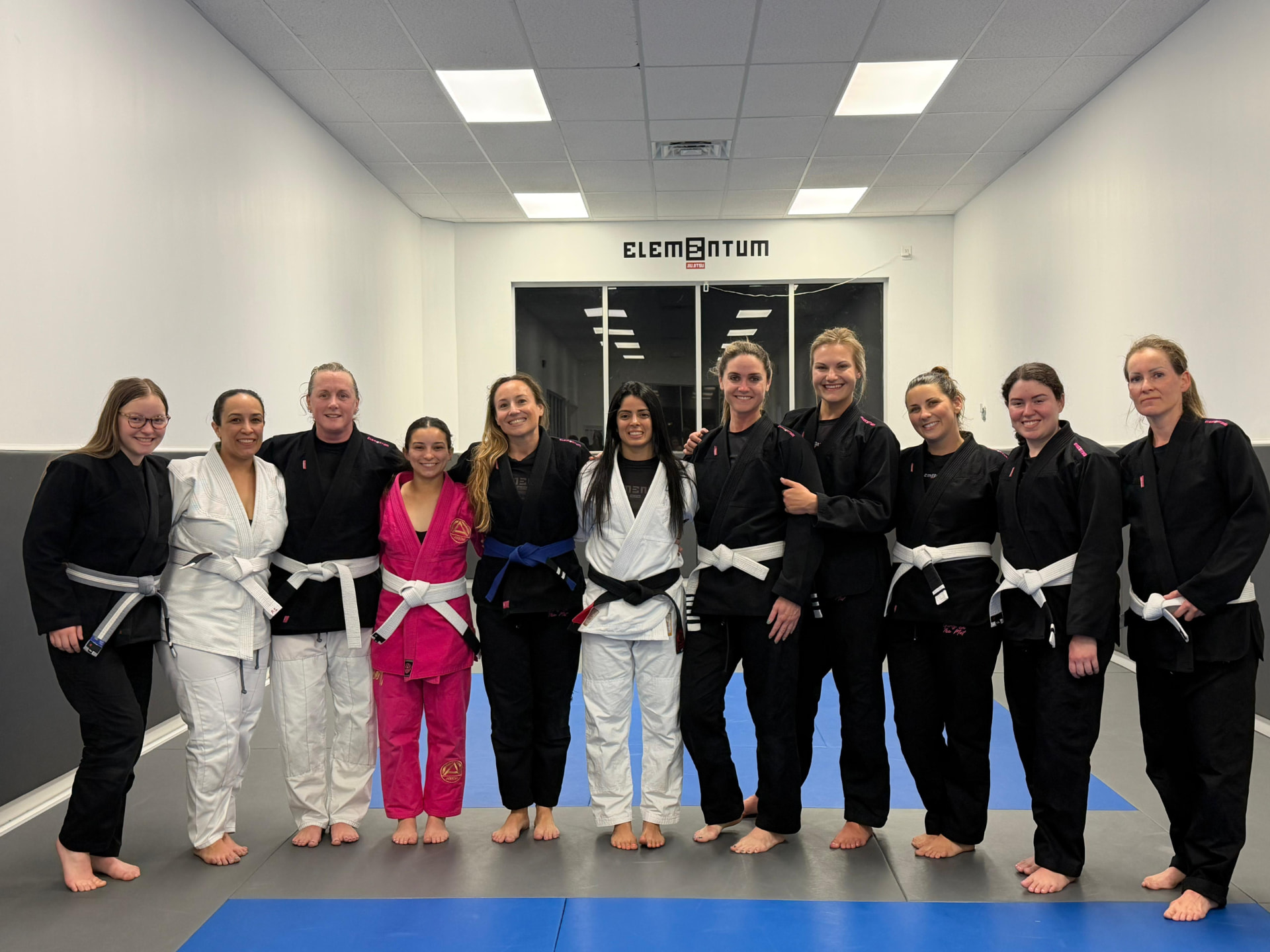 Empowered Women class group photo on the mats